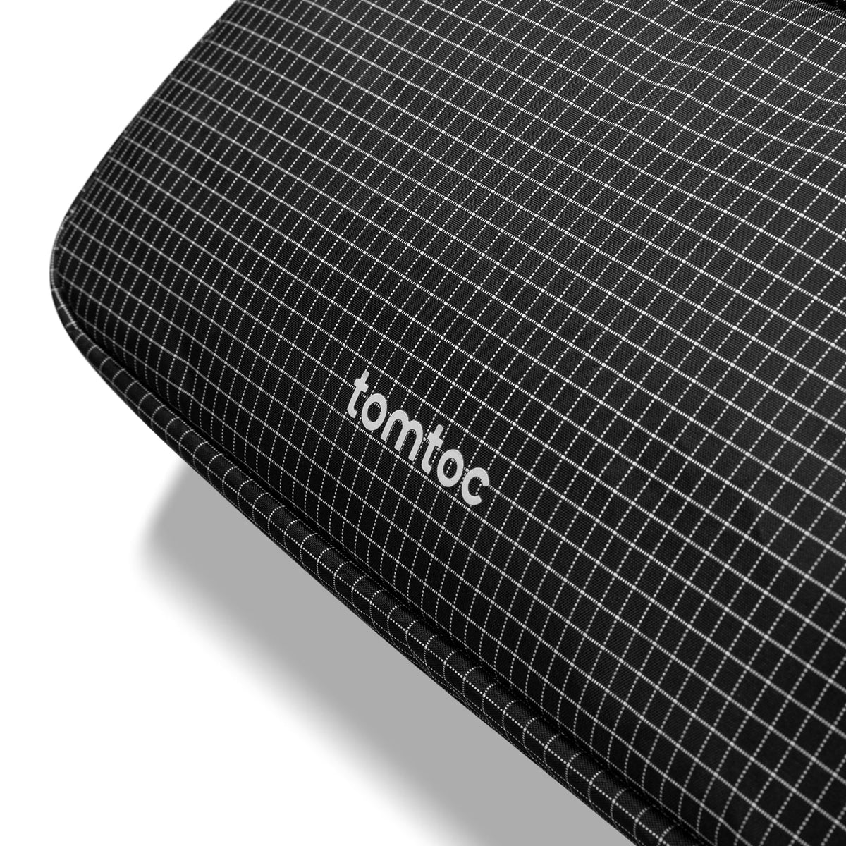 Black grid-patterned product with 'tomtoc' branding on a white background