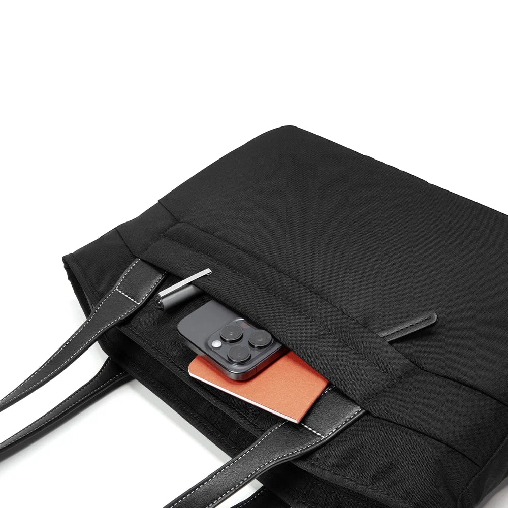 A black tote bag T23S1D1 tomtoc versatile laptop tote bag small with dual shoulder straps shown against a plain white background