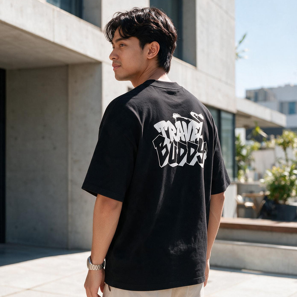A man wearing a tomtoc Signature Unisex Travel Buddy Embroidery short sleeve tee in black colour
