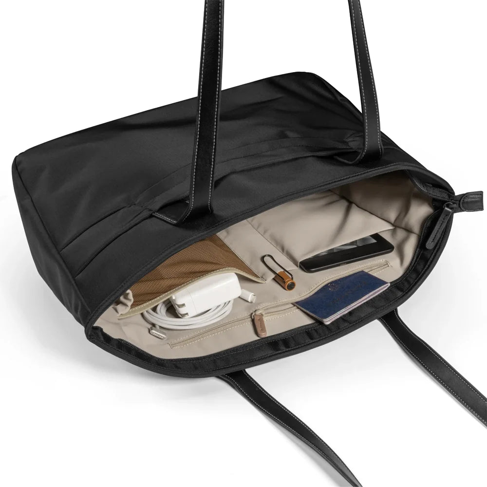 A black tote bag T23S1D1 tomtoc versatile laptop tote bag small with dual shoulder straps and showing inner compartment against a plain white background
